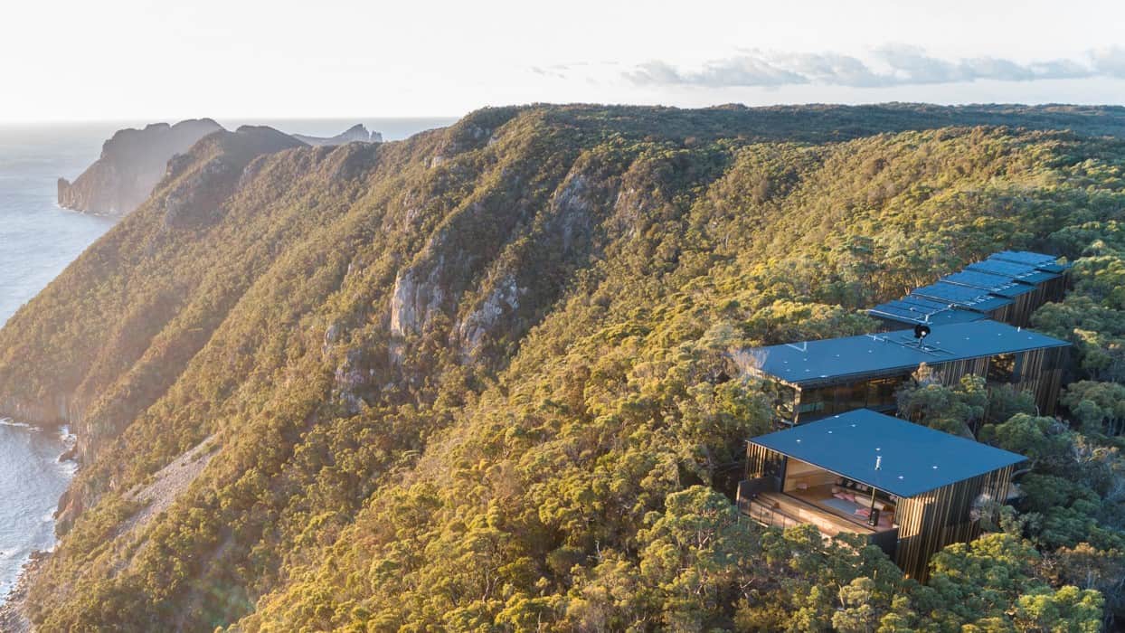 Aerial view of a Tasmanian coastal lodge surrounded by bushland