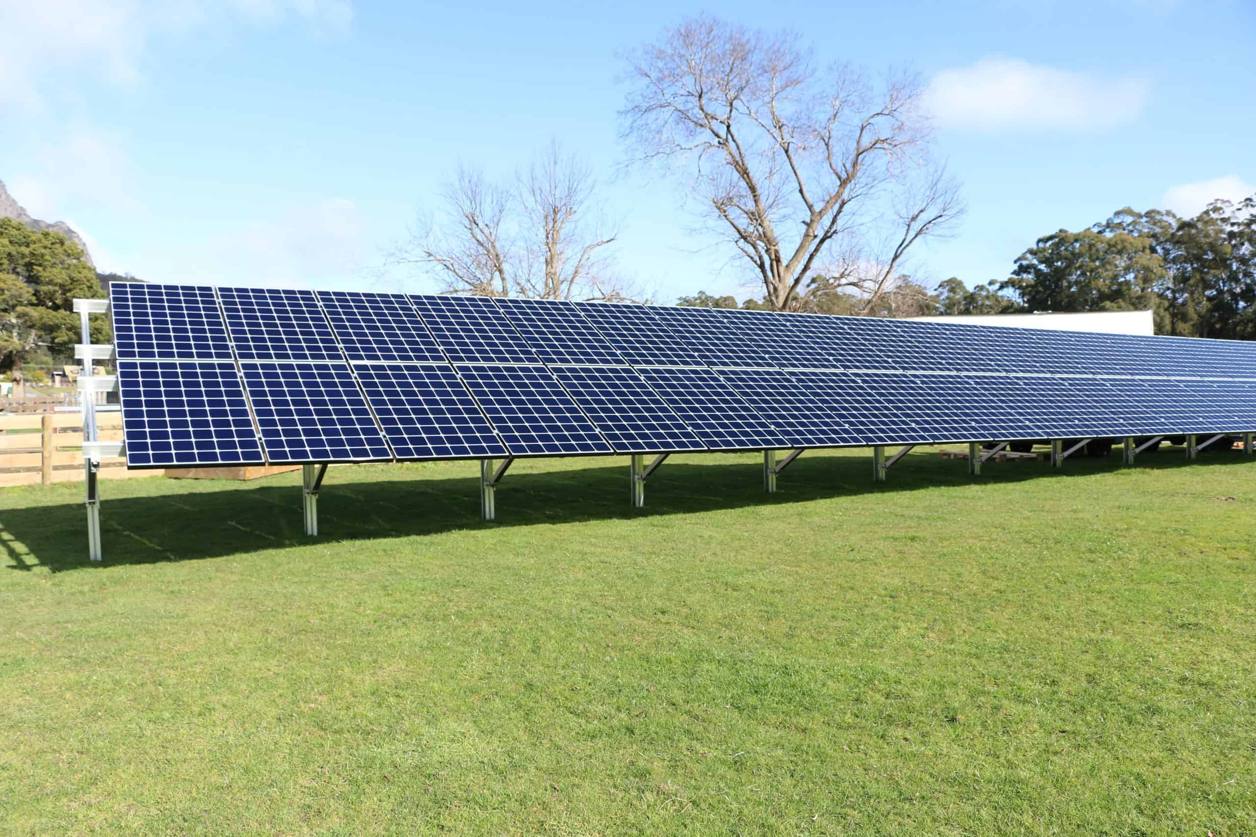 Rows of ground mounted solar panels in a green paddock at The Vale, Sheffield