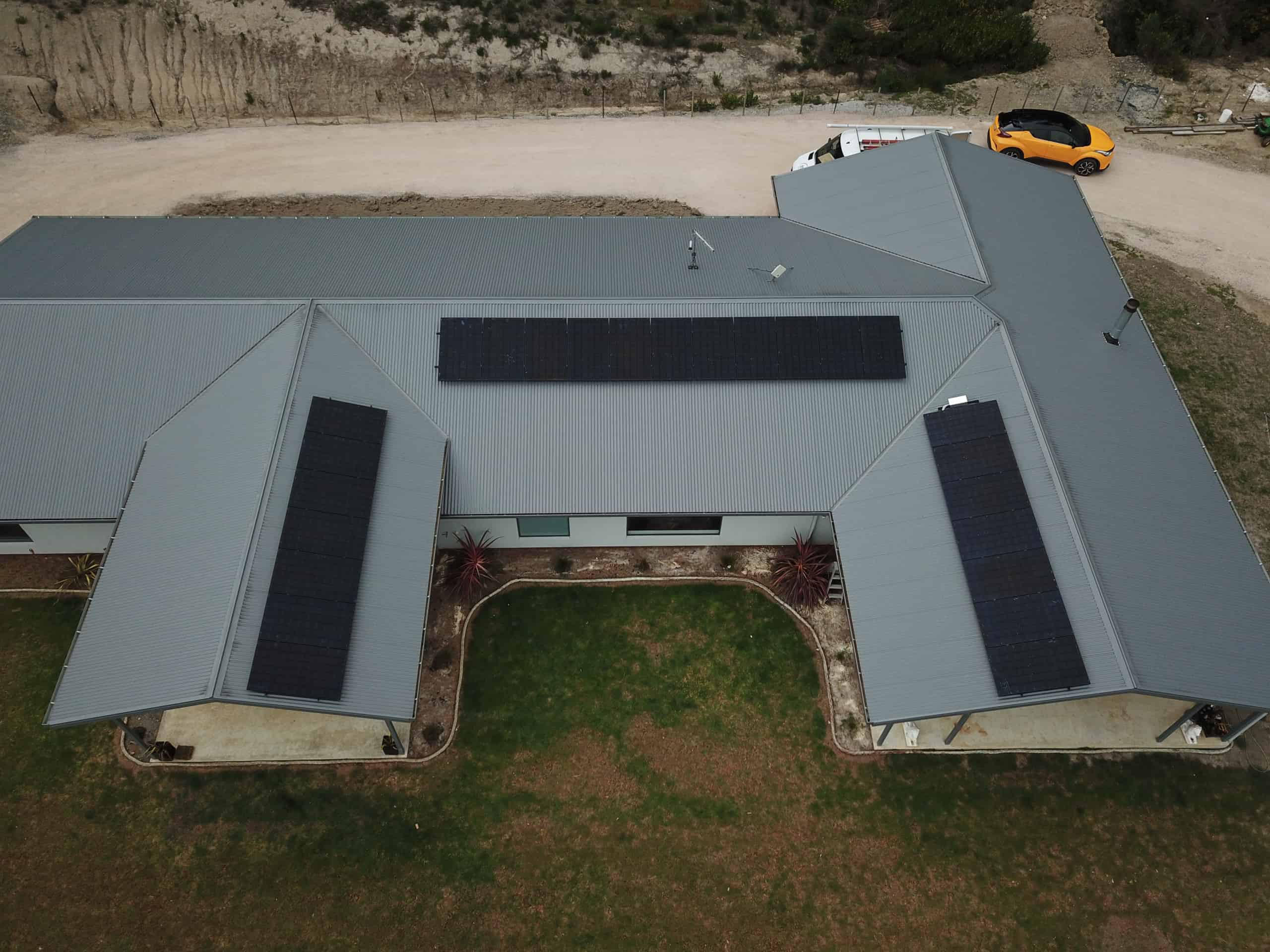 Aerial view of a Tasmanian home with rooftop solar panels