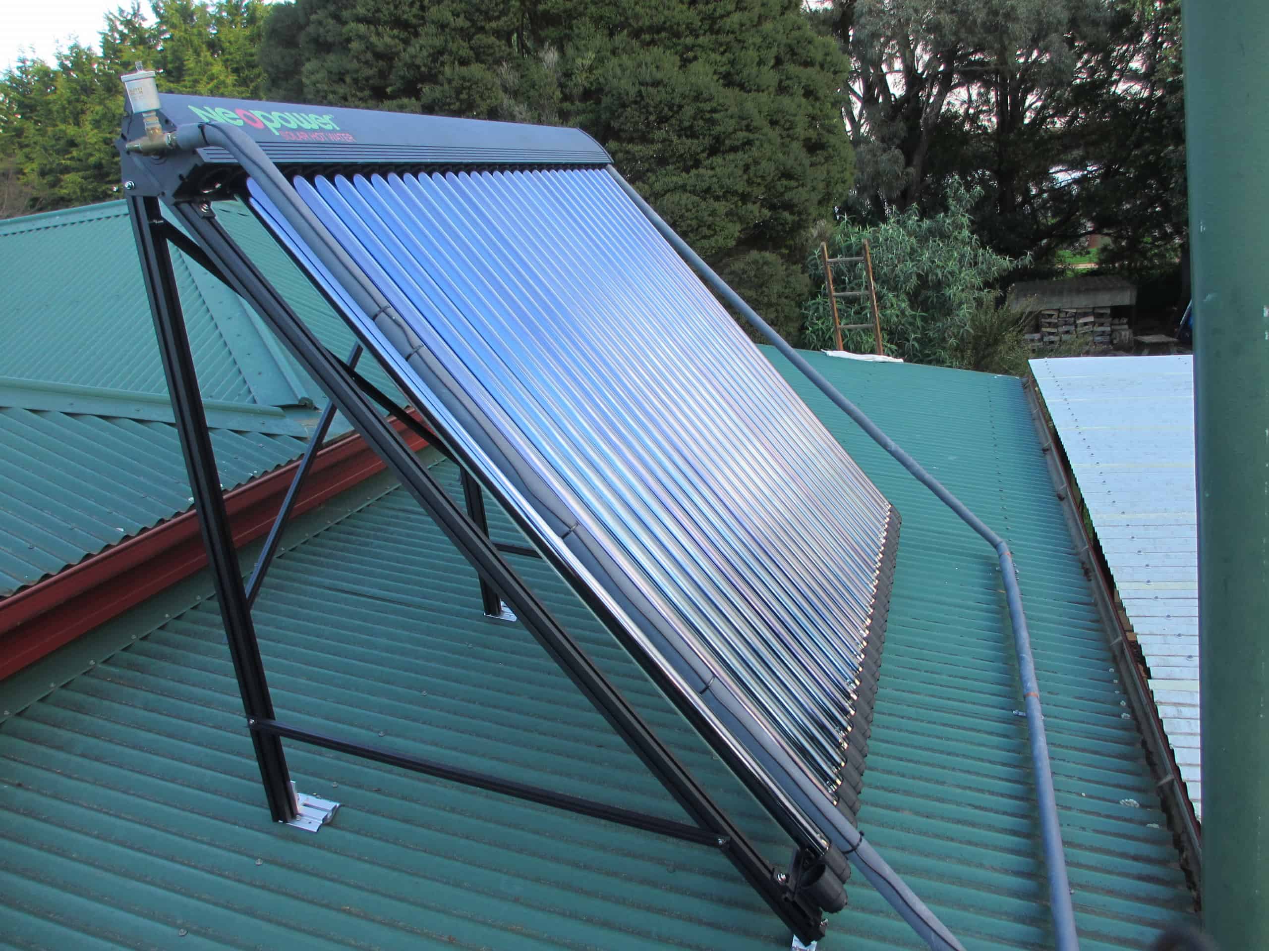 Neopower hot water heat pump installed beside a Tasmanian home