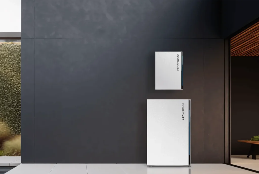 A wall-mounted home battery installed in a garage