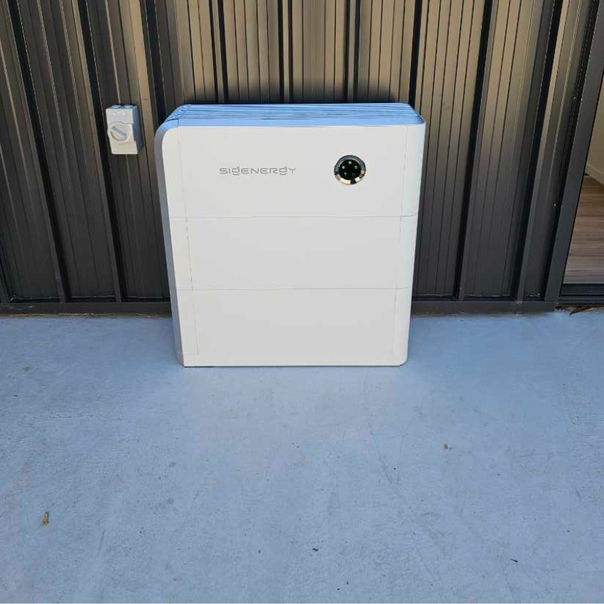 Sigenergy solar battery installed outdoors against a colorbond wall